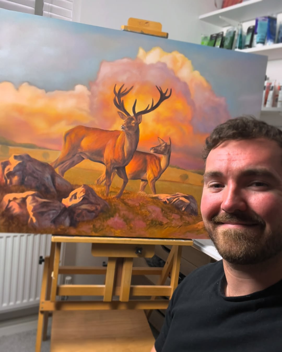 Daniel Wilson with his wildlife painting on ACF canvas