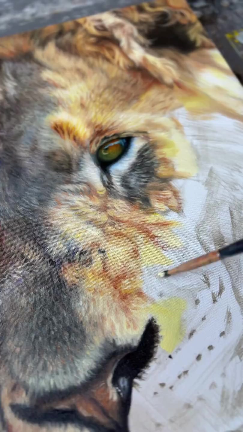 Amber Tyldesley painting fine detail on an ACF canvas, with the weave visible beneath the brush